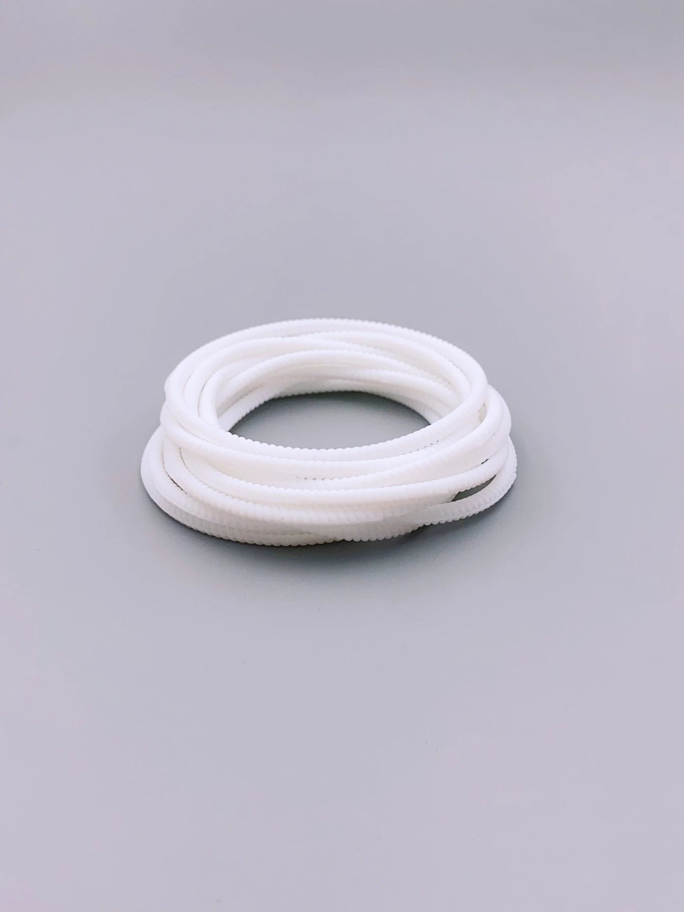 Bracelet Torsadés Blancs Fluorescents classe